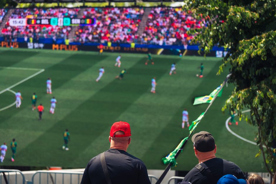 Engaging view of soccer fans enjoying a live match at a stadium in Langford, BC, Canada.