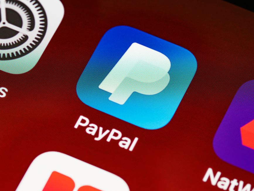 Detailed view of PayPal app icon on a smartphone screen highlighting mobile payment technology.
